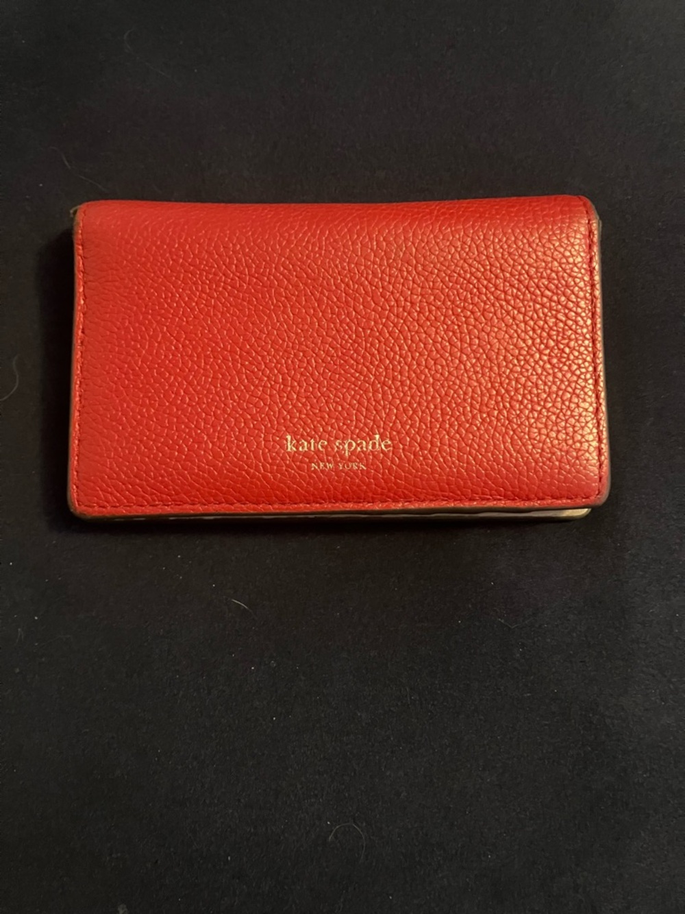 kate spade red pebbled leather wallet with gold logo